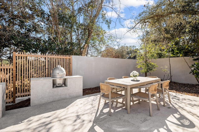 view of patio / terrace featuring outdoor dining space and a fenced backyard
