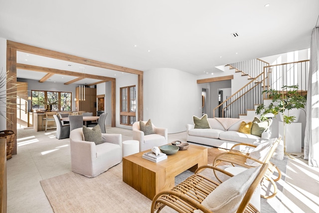 living room featuring recessed lighting, stairway, and beamed ceiling