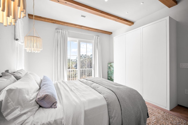 bedroom with recessed lighting, visible vents, beam ceiling, and wood finished floors