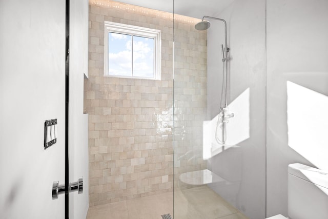 full bathroom with toilet and a walk in shower