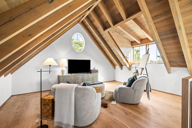 living area featuring wood ceiling, a healthy amount of sunlight, and vaulted ceiling with beams