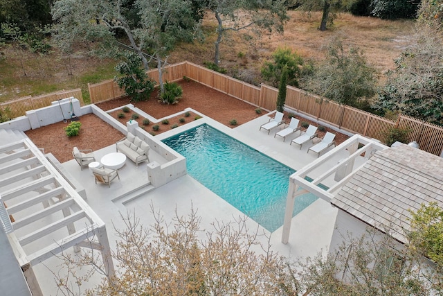view of swimming pool with a patio, a fenced backyard, and a fenced in pool
