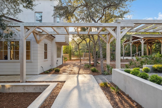 view of patio with fence and a pergola