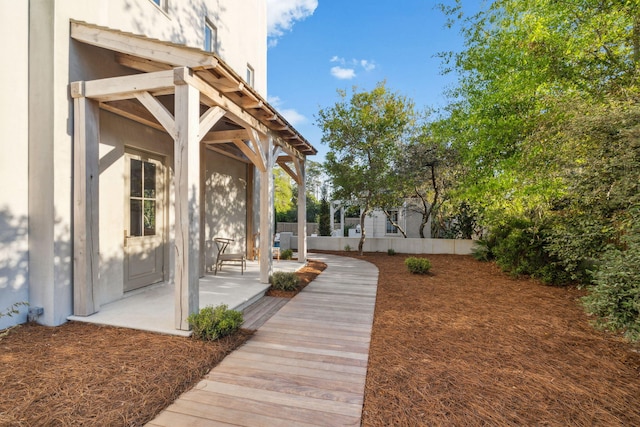 view of patio featuring fence