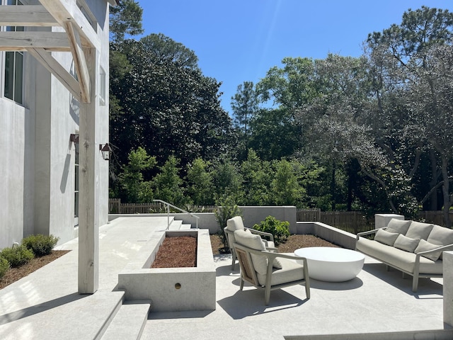 view of patio / terrace with a fenced backyard and an outdoor living space