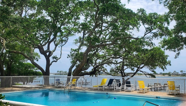 community pool featuring fence