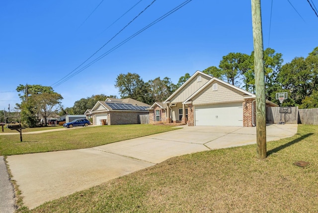 view of front of property with a garage, brick siding, concrete driveway, fence, and a front yard