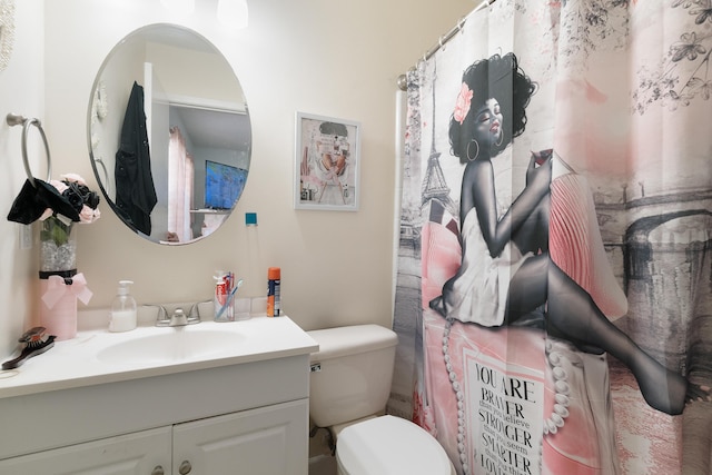 bathroom with toilet and vanity