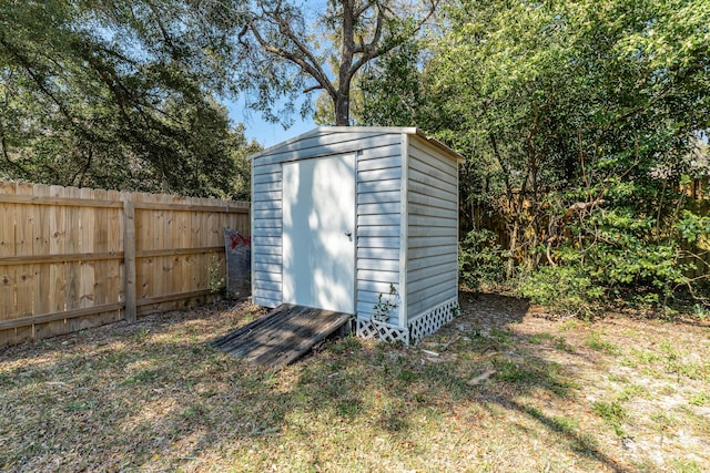 view of shed featuring a fenced backyard