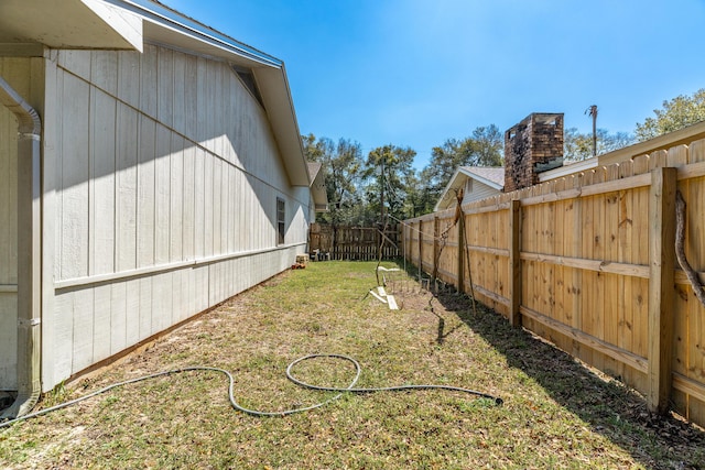 view of yard featuring a fenced backyard