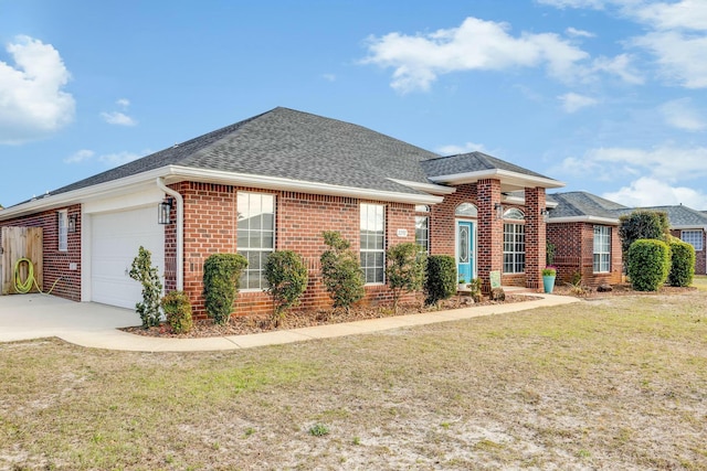 view of front of home with brick siding, a shingled roof, concrete driveway, a front yard, and a garage