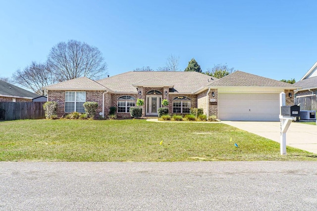 ranch-style home featuring fence, a front lawn, concrete driveway, and brick siding