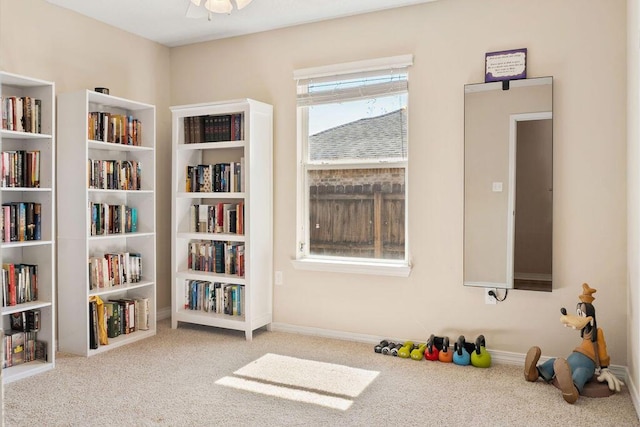 rec room with carpet flooring and baseboards