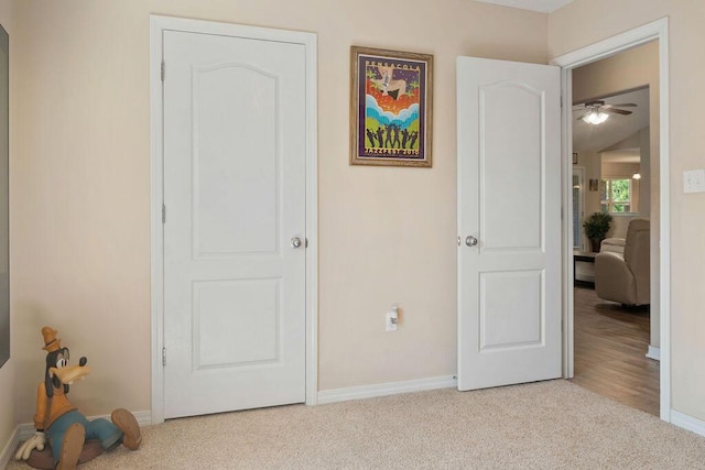 carpeted bedroom featuring baseboards