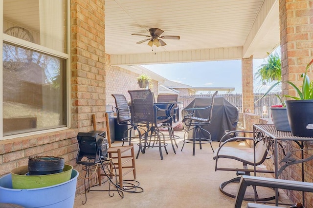 view of patio / terrace featuring a grill, fence, and ceiling fan