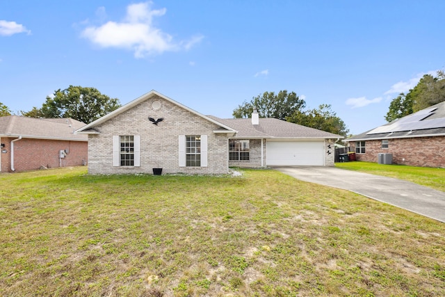 ranch-style home with a garage, brick siding, concrete driveway, a chimney, and a front yard