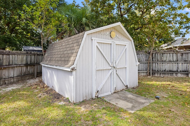 view of shed featuring a fenced backyard