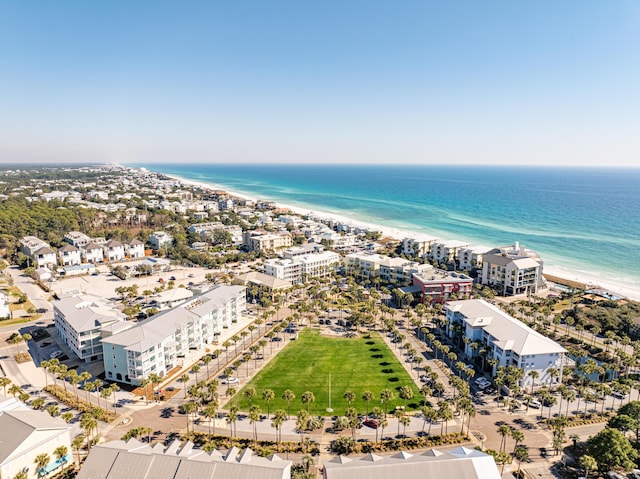 drone / aerial view with a water view and a beach view