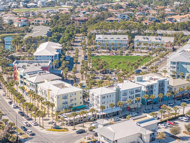 drone / aerial view featuring a water view and a residential view