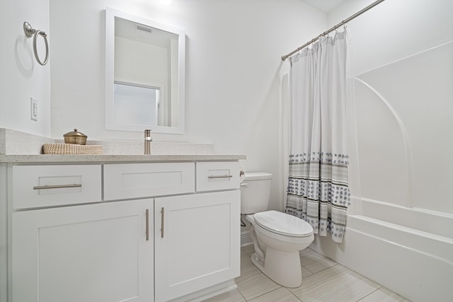 bathroom featuring shower / tub combo, vanity, and toilet