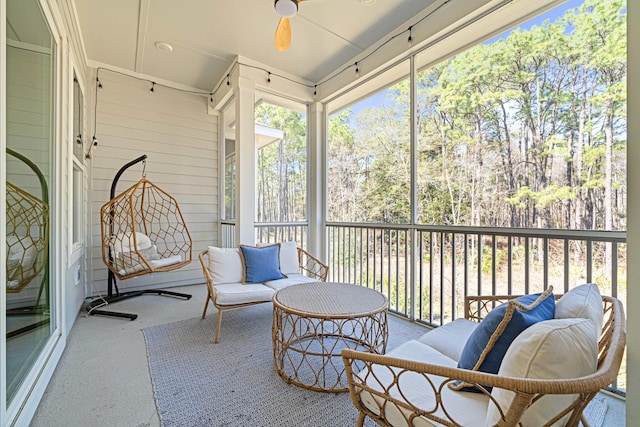 sunroom with a ceiling fan