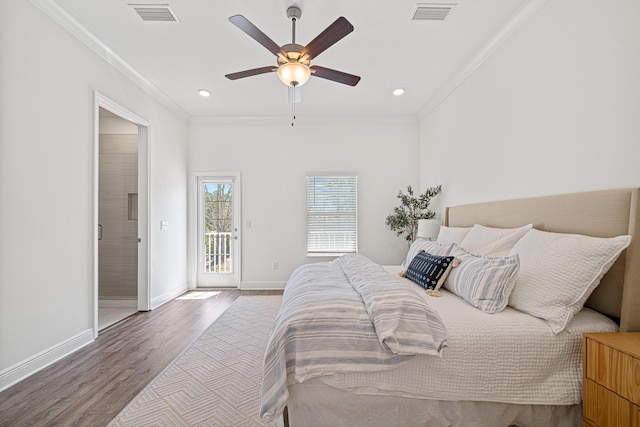 bedroom featuring access to exterior, visible vents, and ornamental molding