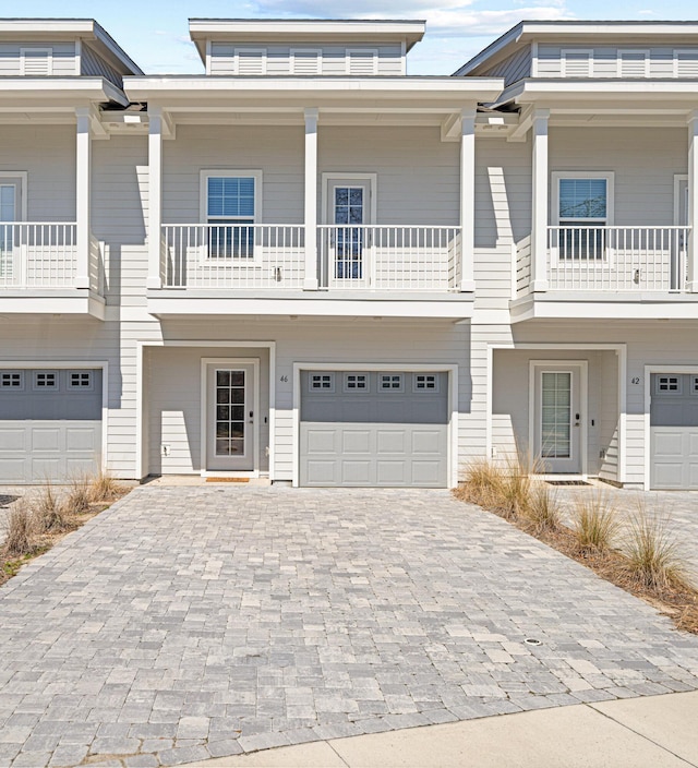 view of front of home featuring a garage and decorative driveway