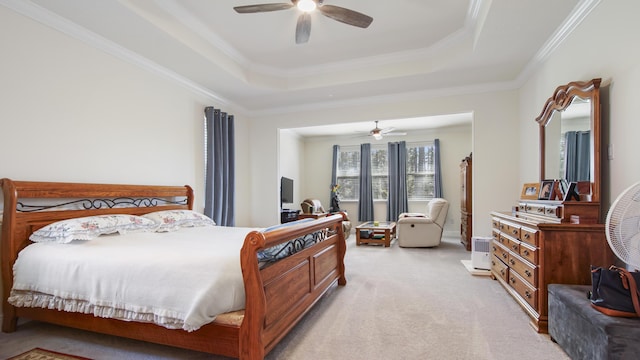 279 Tournament Ln, Freeport, FL 32439 - bedroom featuring a ceiling fan, a raised ceiling, crown molding, and light colored carpet
