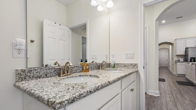 279 Tournament Ln, Freeport, FL 32439 - bathroom with double vanity, wood finished floors, a sink, and crown molding