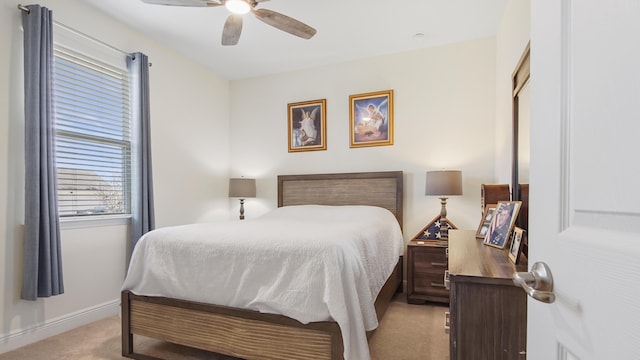 279 Tournament Ln, Freeport, FL 32439 - bedroom with a ceiling fan, light colored carpet, and baseboards
