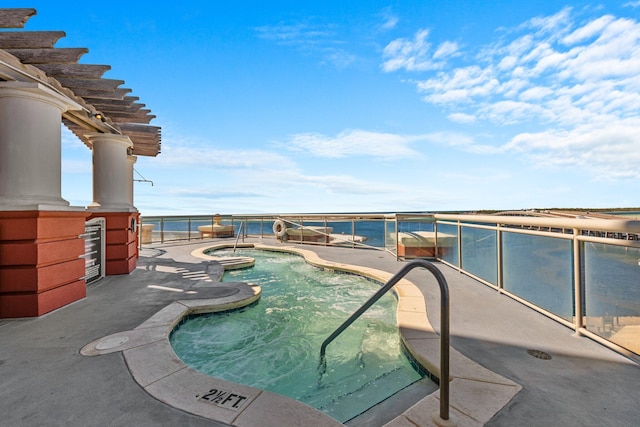 view of pool featuring a pool and a hot tub