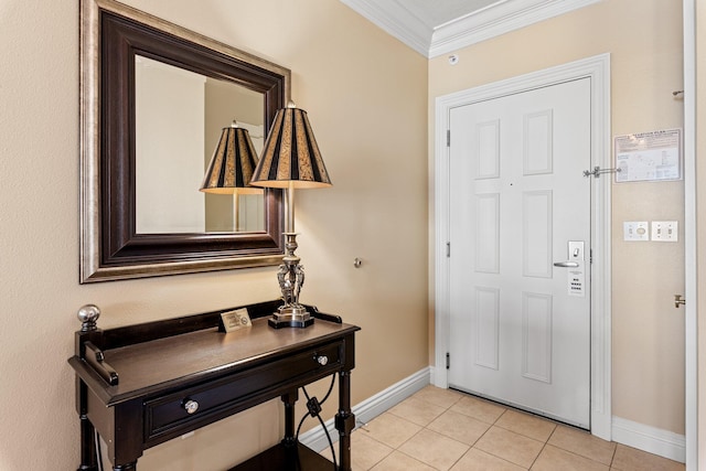 entrance foyer featuring crown molding, baseboards, and light tile patterned floors