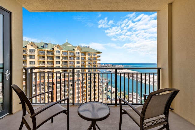 balcony featuring a water view