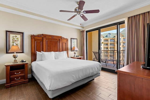 bedroom featuring ornamental molding, access to outside, dark wood-type flooring, and baseboards