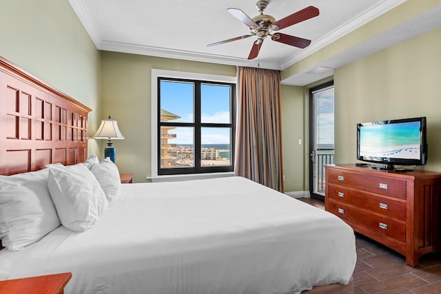 bedroom featuring baseboards, a ceiling fan, crown molding, and wood finish floors