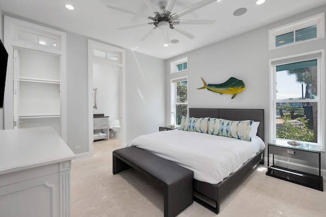 bedroom with baseboards, multiple windows, and recessed lighting