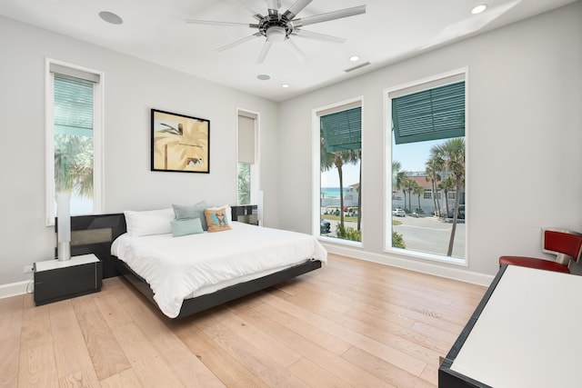 bedroom with recessed lighting, visible vents, light wood-style flooring, and baseboards