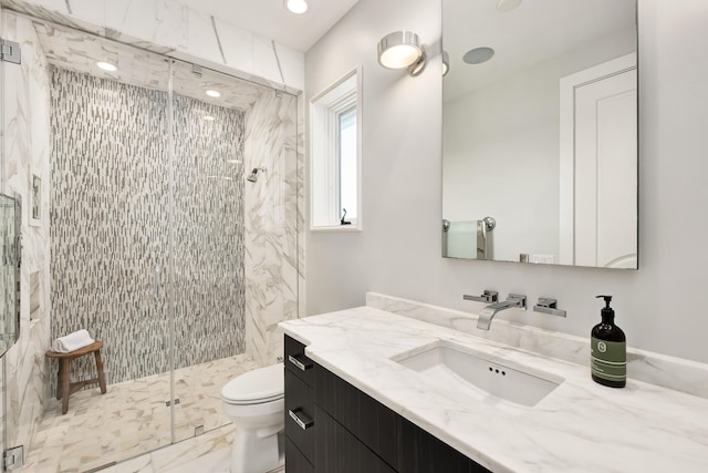 full bath with marble finish floor, vanity, a shower stall, and toilet