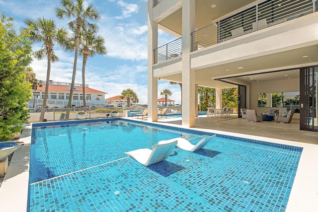 view of pool with fence, a fenced in pool, and a patio