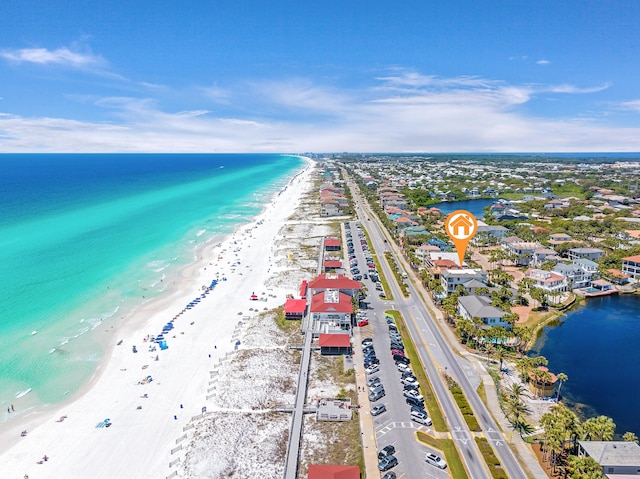 drone / aerial view with a water view and a view of the beach