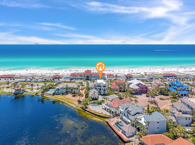 birds eye view of property featuring a water view and a residential view