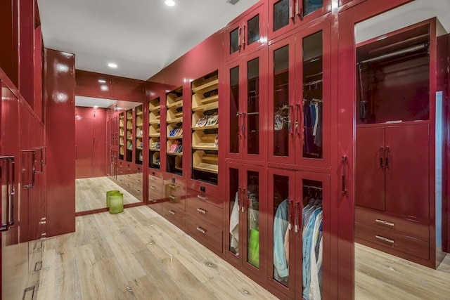 wine cellar featuring wood finished floors and recessed lighting