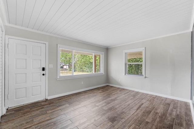 entryway featuring ornamental molding, dark wood-type flooring, and baseboards