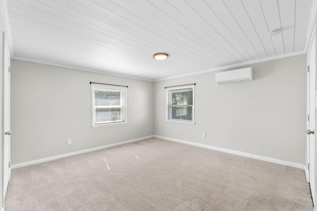 unfurnished room featuring ornamental molding, a wall mounted AC, carpet, and baseboards