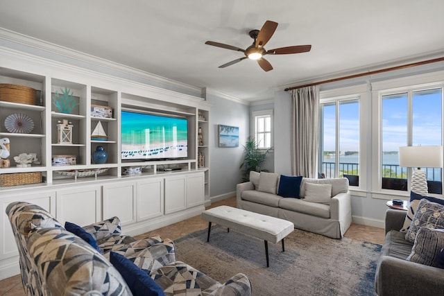 living room with baseboards, a ceiling fan, light tile patterned floors, and ornamental molding