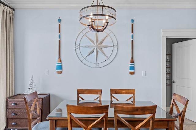 dining space featuring crown molding and a chandelier