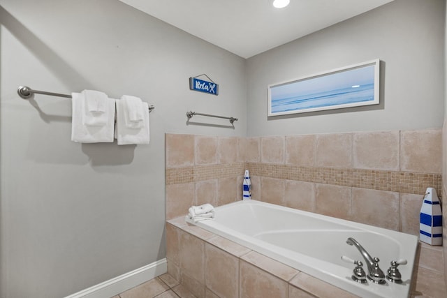bathroom featuring recessed lighting, baseboards, tile patterned flooring, and a bath