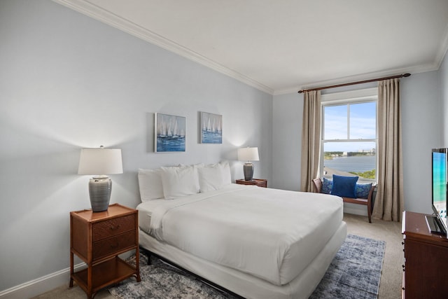 bedroom featuring light colored carpet, ornamental molding, and baseboards