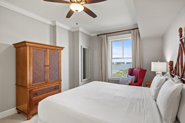 bedroom with a ceiling fan, baseboards, a water view, ornamental molding, and light carpet