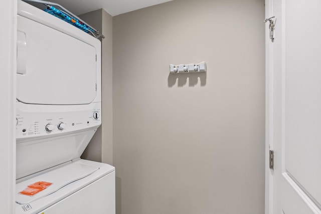 laundry area featuring laundry area and stacked washer and dryer